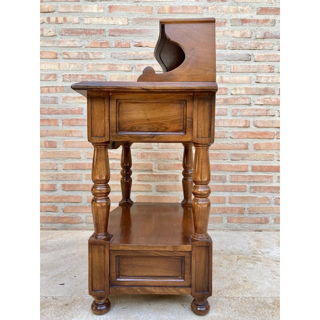 Fabulous pair of tufted nightstands from the 1960s. It has a drawer at the bottom and another at the top, which rests on...