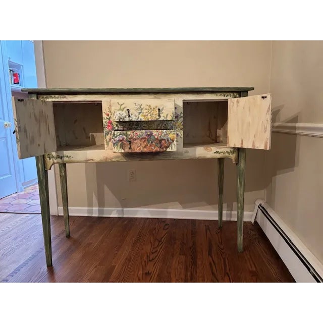 Habersham Plantation hand-painted sideboard featuring a floral design. It has two central drawers with a cabinet on both...
