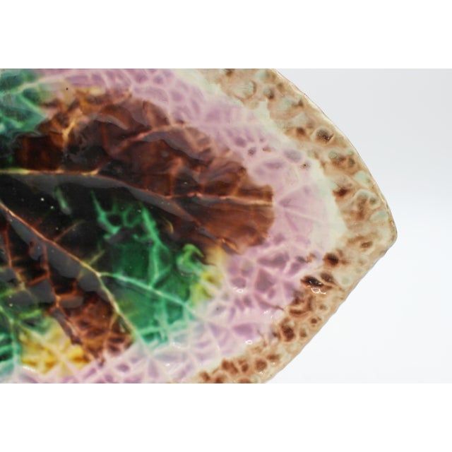 Circa 1880s English majolica begonia leaf sweetmeat dish. Brightly colored in mauve, lilac, yellow, green & brown glazes....