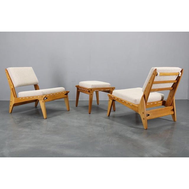 - Carefully refurbished - Upholstered in boucle fabric - Ottoman Dimensions: 43x56x45 This piece is attributed to the...