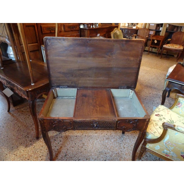 Beautiful late 18th century French walnut writing table . The top opens up showing 2 compartments and one drawer. Cabriole...