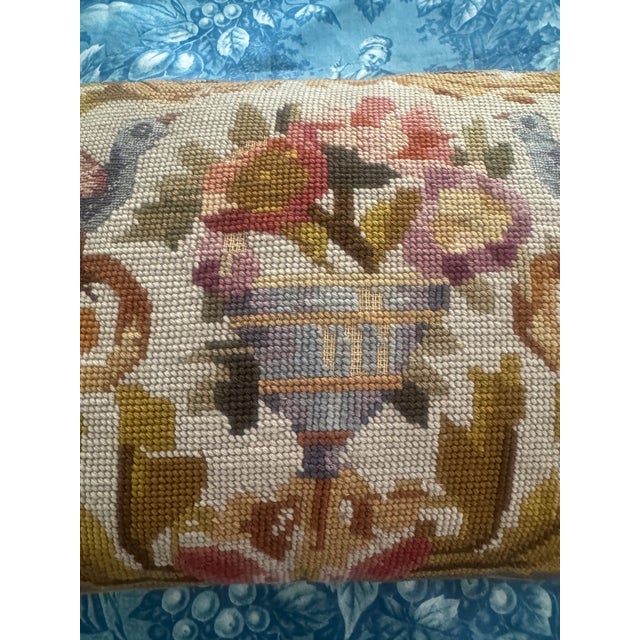 Listing is for a vintage neoclassical needlepoint pillow with urn of flowers flanked by a pair of birds done in petit...