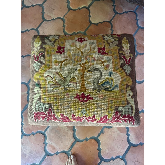 Lovely old needlepoint and petit point footstool. Beautiful carved frame. Could be English or French.