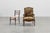 A richly detailed French walnut armchair from around 1880, offering decorators an elegant blend of sculptural woodworking...
