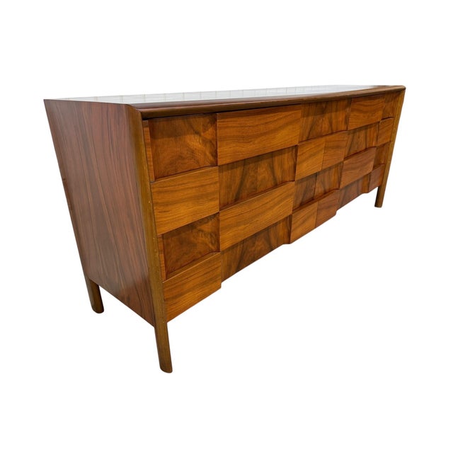 Make a bold statement with this rare circa 1960s Mid-Century Modern Brutalist 8-drawer dresser, designed by Edmond J....