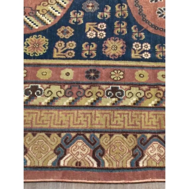 This antique Khotan/Samarkand rug from East Turkestan, dating back to circa 1900, exudes timeless elegance. Characterized...