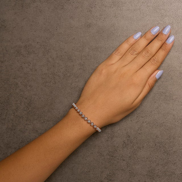 Early 21st Century 14K Rose Gold Plated .925 Sterling Silver 1/10 Cttw Diamond Open Circle Beaded Wheel Link Tennis Bracelet (I-J Color, I3 Clarity) - 7.25" For Sale - Image 5 of 6