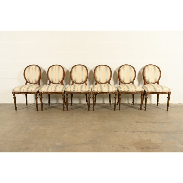 A gorgeous set of six French Regency Louis XVI style dining chairs In the manner of Karges Furniture USA, Circa 1960s...