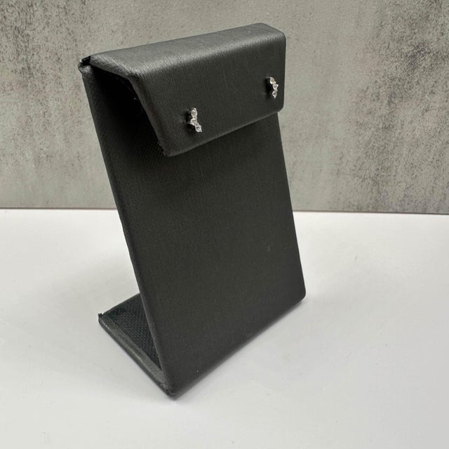 These elegant Modern Diamond Stud Earrings in 14kt white gold feature 0.14ctw of natural GH SI round diamonds, offering a...