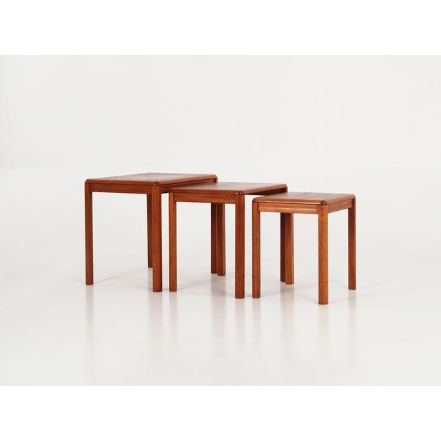 The set of three tables was made in the 1970s, Danish production. The legs are made of solid wood. The tops of the tables...