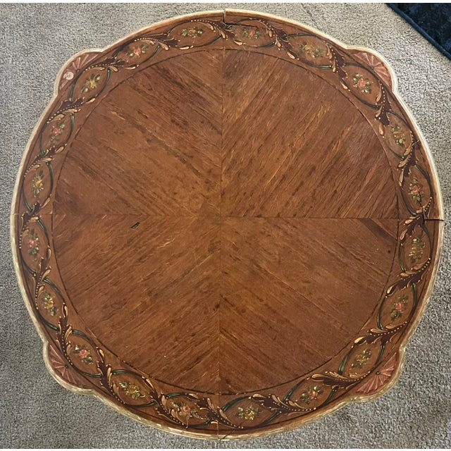 French accent table. Louis XVI style with neoclassical details. 21 1/2" dia x 21 1/2" high. Stained wood bookmatched top...