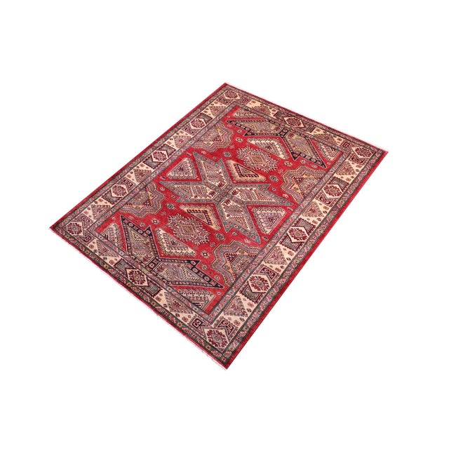 Enhance your home with this exquisite hand-knotted Super Kazak rug, crafted from fine hand-spun wool and dyed with all-...