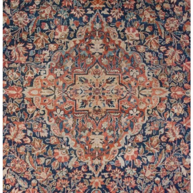 An amazing late 19th century Persian Tabriz rug with an intensely woven multicolored floral pattern in crimson, indigo,...