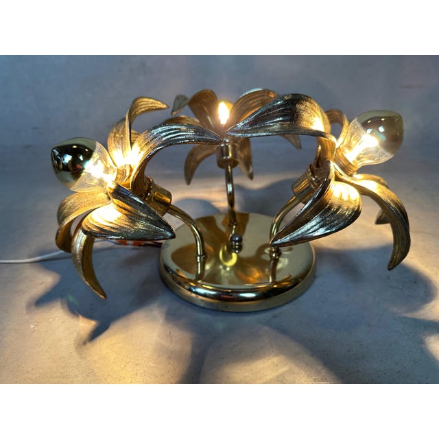 A ceiling or wall lamp from Massive Belgium. Was attributed to Willy Daro in the 1970s. Version with 3 flowers. Labeled....