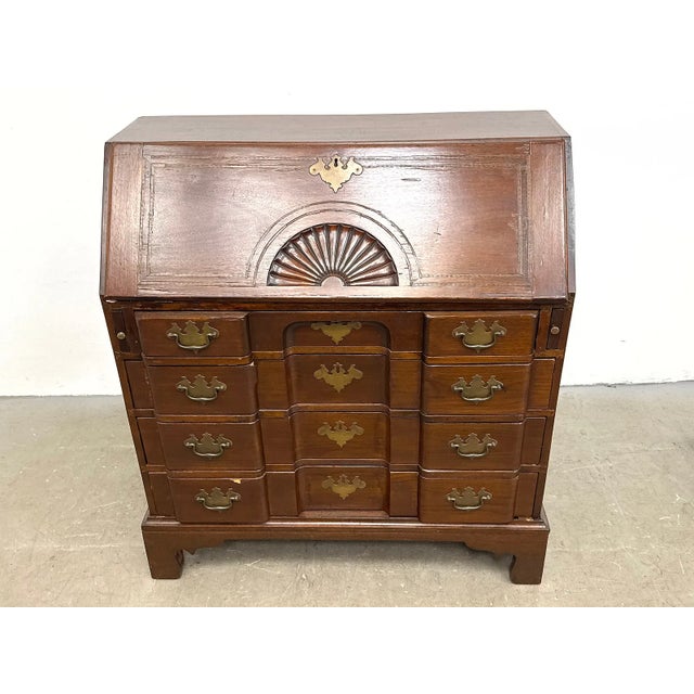 Antique Chippendale-style mahogany secretary desk featuring a distinctive block-front design, slant-front writing surface,...