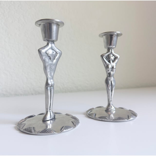 An artful pair of pewter candlesticks by renowned South African artist Carrol Boyes (1954-2019), produced circa...