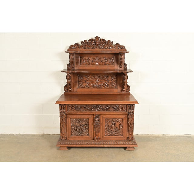 An exceptional antique Victorian or Renaissance Revival sideboard, credenza, or bar cabinet In the manner of Alexander...