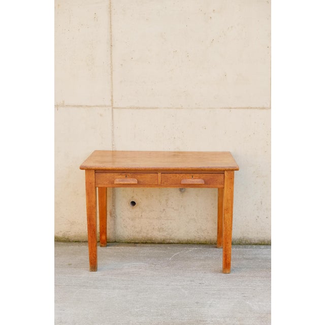 English Edwardian oak desk, handsomely made by ‘Mills & Mills Ltd' Coventry. Classic English solid oak desk from the...