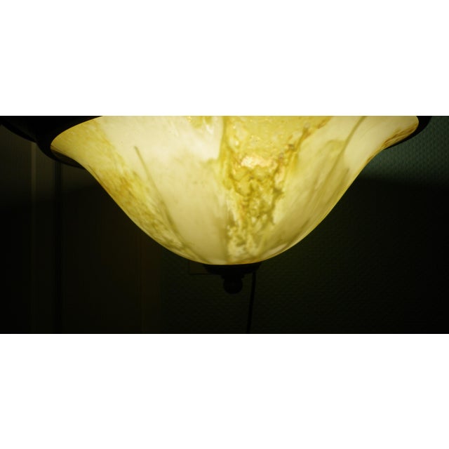 1960s pendant light. Origin: Portugal, J.P.M. Metal suspension chains, gold-tone metal shade, 35 cm diameter shade. Opaque...