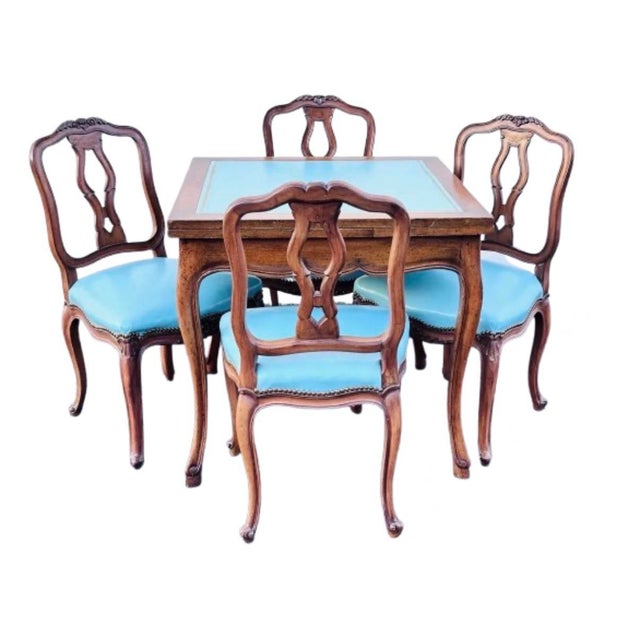 A fantastic Hollywood Regency game table with 4 matching chairs simply stunning style and color. A very unique and rare...