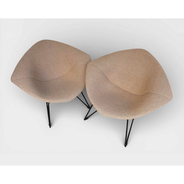 Beautiful pair of Diamond Chairs designed by Harry Bertoia in 1952 and produced by Knoll International in the 1970s. The...
