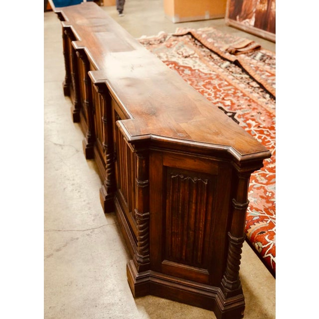 A room-defining, architectural sideboard that reads more like a built-in than a piece of furniture. Monumental in both...