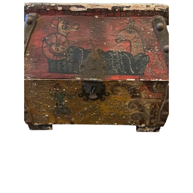 A Antique Reliquary Box adorned with paintings of Jesus, and Holy Figures. These were often portable for processions or...