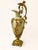 An exceptional pair of decorative jugs crafted from ceramic and richly adorned with mercury-gilt bronze (ormolu) mounts,...