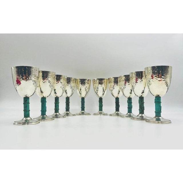 A refined and highly collectible set of ten silver-plated goblets designed and handcrafted in Taxco, Mexico by renowned...