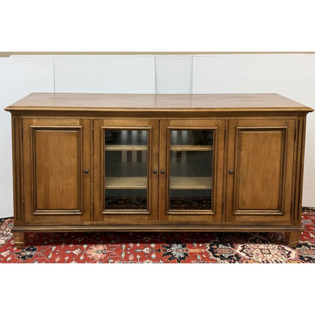 Design Plus Gallery presents the Jason Buffet with Glass Doors from Ethan Allen. The buffet is constructed from maple and...