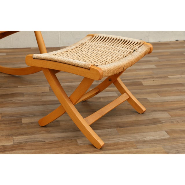 A beautifully crafted Mid-Century Modern rocking chair with matching folding ottoman, made in Yugoslavia during the 1960s....