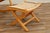 A beautifully crafted Mid-Century Modern rocking chair with matching folding ottoman, made in Yugoslavia during the 1960s....