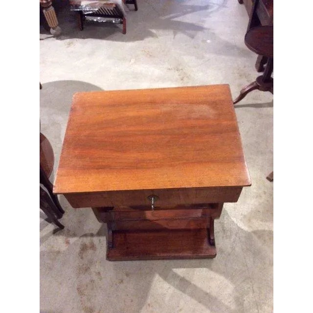 Found in France, this Late 1800's French Side table was crafted with a lift top that opens to reveal a mirror and storage...