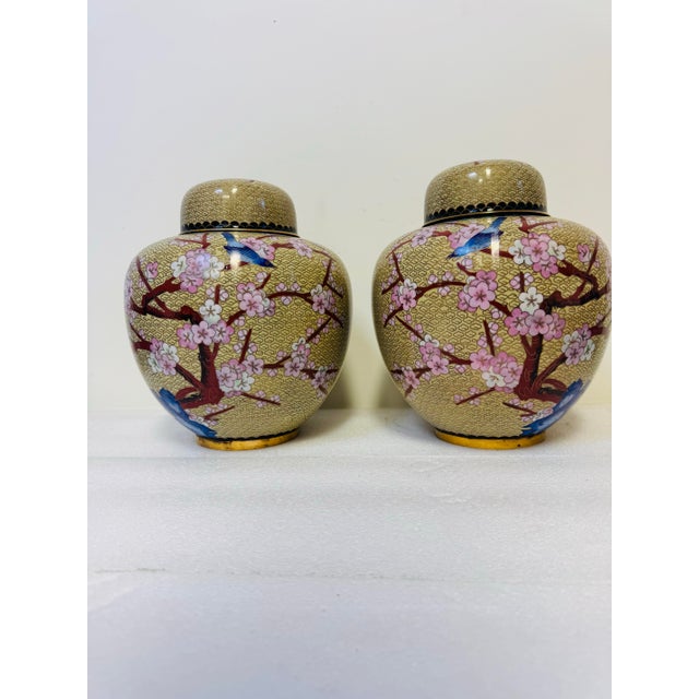 Late 20th Century Pair of Vintage Chinese Cloisonné Ginger Jars Featuring Intricate Enameled Bird and Floral Designs on a Patterned Beige Background. For Sale - Image 5 of 7