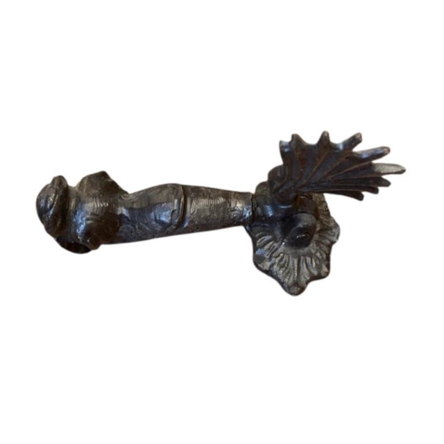 Add classical architectural character to your entry door with this solid cast iron door knocker. Designed in the...