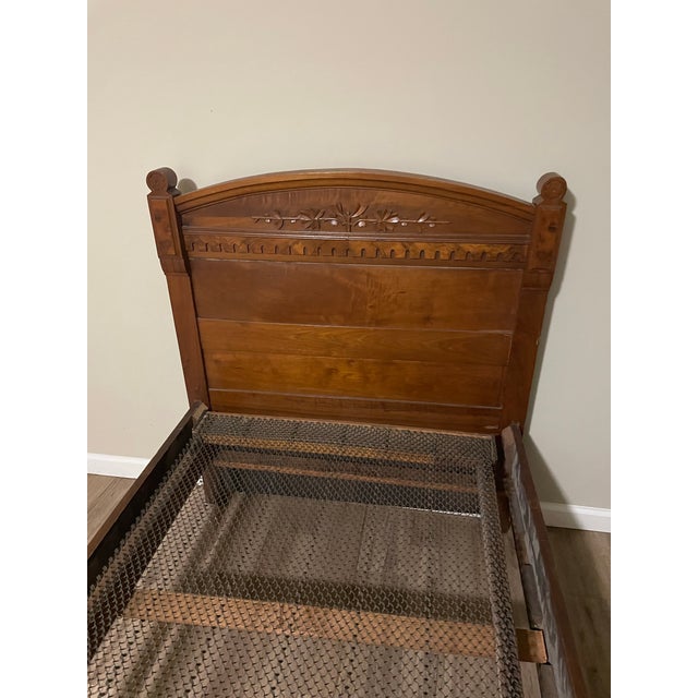 Very nice twin bed with carved head and footboard. Antique- not sure of age. Spring frame with slats included. Mattress...