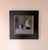 This oil on panel artwork features a harmonious arrangement of reflective spheres and a sculptural form, all set against a...