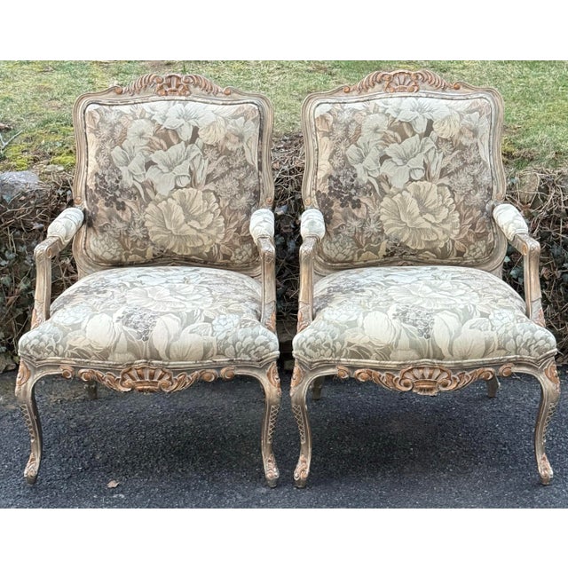 Gorgeous pair of generously proportioned Bergere chairs by Kreiss collection . Features a floral tapestry upholstery,...