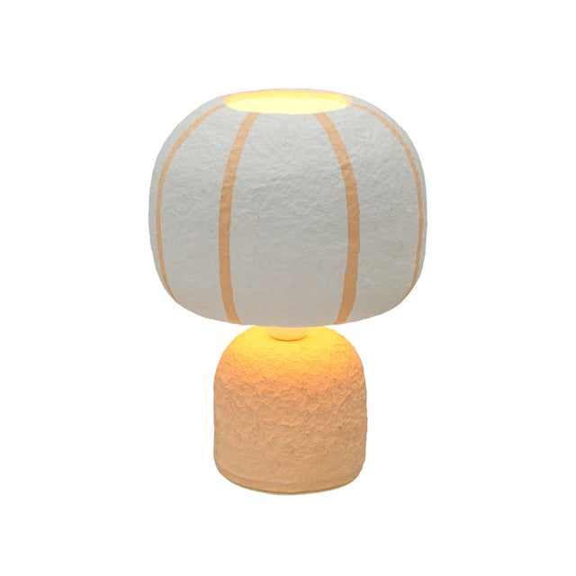 The Margate Table Lamp is a small piece with a lot of personality. Made from textured cotton mache, it brings an earthy...