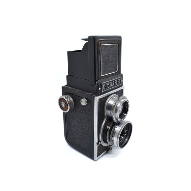 The 1950's Crystar Flex 80mm F3.5 TLR (Twin-Lens Reflex) Film Camera is a rare and coveted gem from the golden era of...