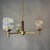 Striking three-light Mid-Century Modern chandelier, combining warm wood, brass-toned metal and exceptionally sculptural...