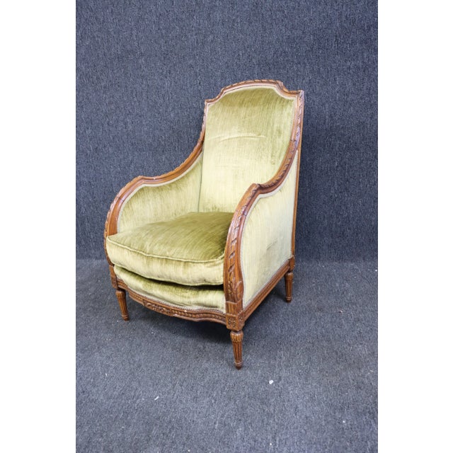 Late 19th Century Louis XVI style Bergere. Detailed Hand carved walnut frame , light green velvet upholstery