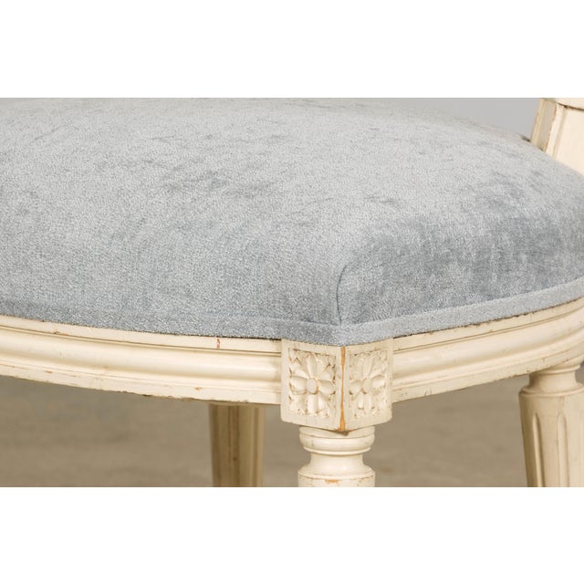 Set of six French Louis XVI dining chairs sourced in Provence. Crafted in the early 20th century, the chairs feature...
