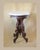 This antique Victorian center table has a beveled marble top and carved mahogany base. The four legs radiate from a...