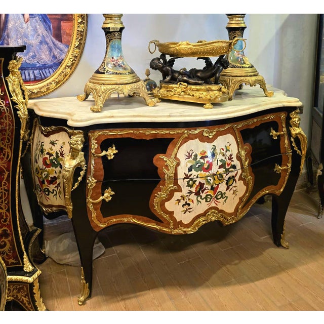 A true work of art, this French Louis XV Bombe Chest blends exceptional craftsmanship with timeless elegance. Featuring a...