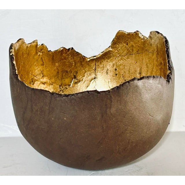 This Japanese ceramic wabi sabi bowl is gilt lined and fashioned in an organic style. Makers mark on the bottom.