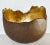 This Japanese ceramic wabi sabi bowl is gilt lined and fashioned in an organic style. Makers mark on the bottom.