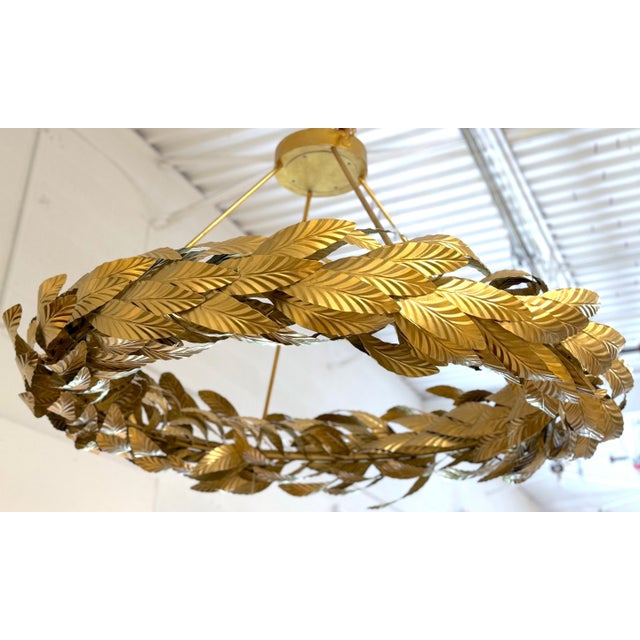 Apollo Grand Circular Laurel Leaf Chandelier in Gilt Wrought Iron An impressive and highly decorative circular chandelier...