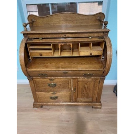 Crafted in the late 19th century, this stunning cylinder roll-top desk is made from beautifully grained quarter sawn oak...