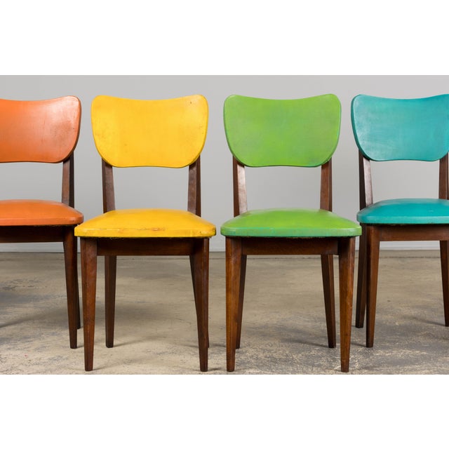 A playful and one-of-a-kind set of six 1960s French mid-century modern dining chairs, sourced from Provence, France. Each...